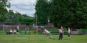 Group playing crown green bowls